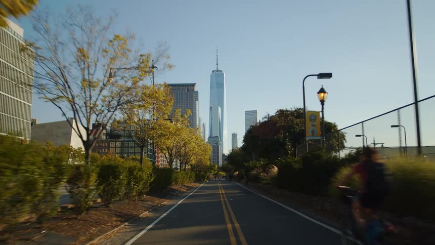 A view driving down a road in a city