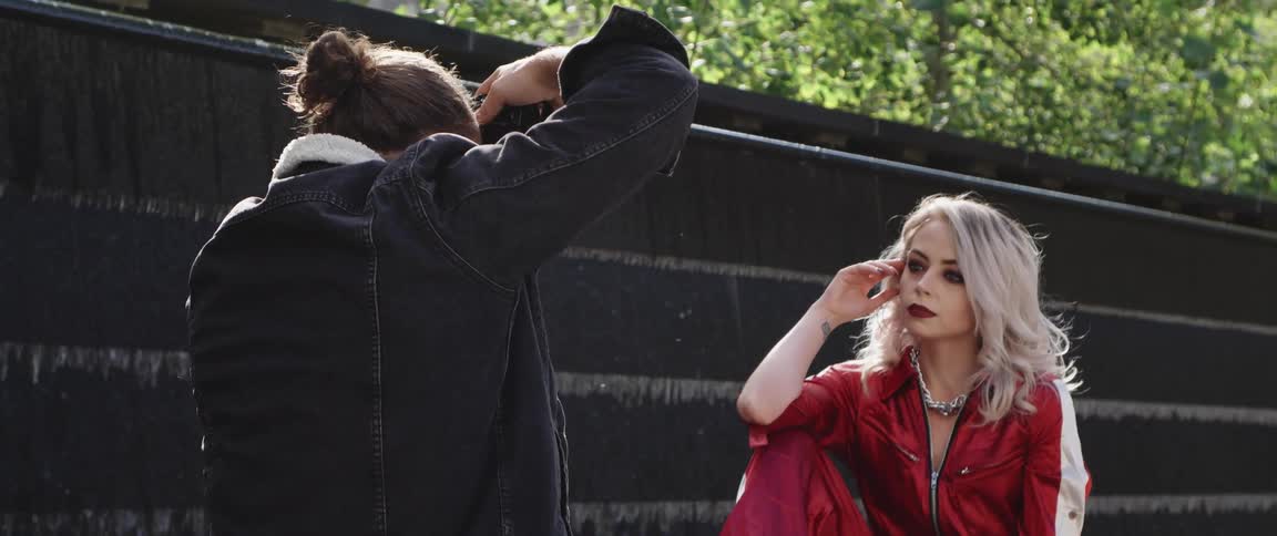 A female models for a male photographer