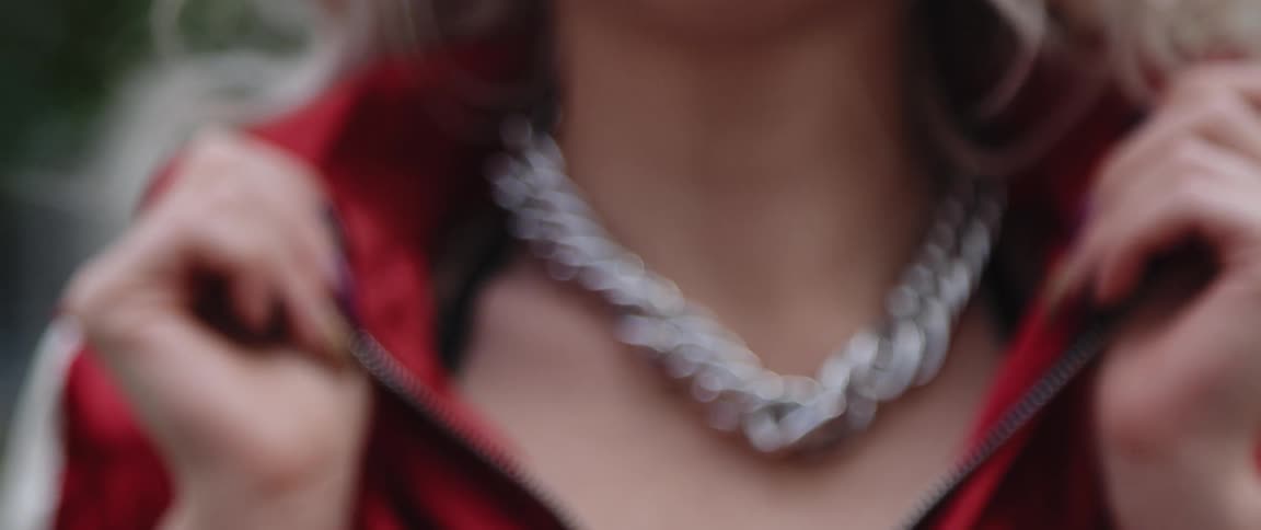 Close up view of a woman wearing a necklace