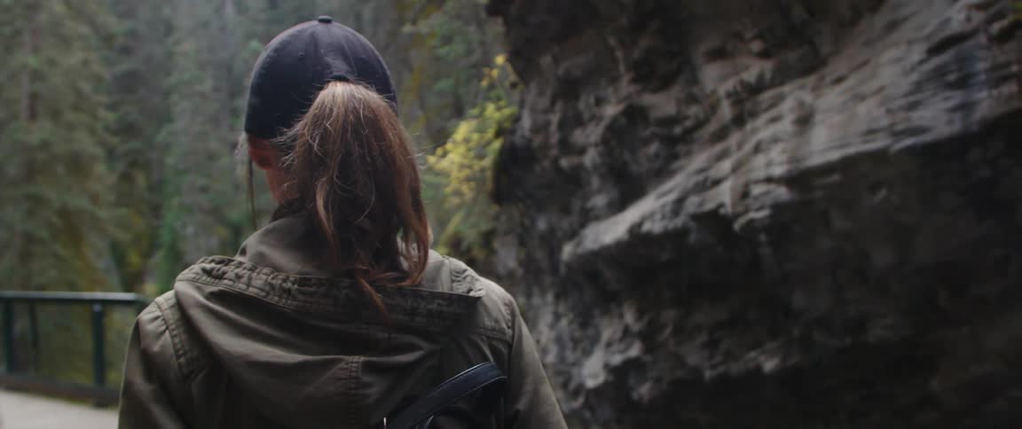 A woman is hiking through the wilderness