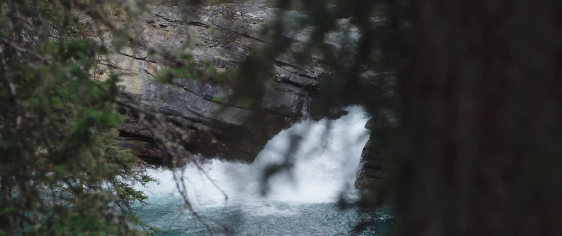 A waterfall crashing in to a river