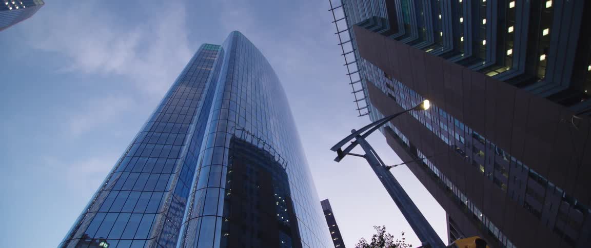 Office buildings against the sky at dusk