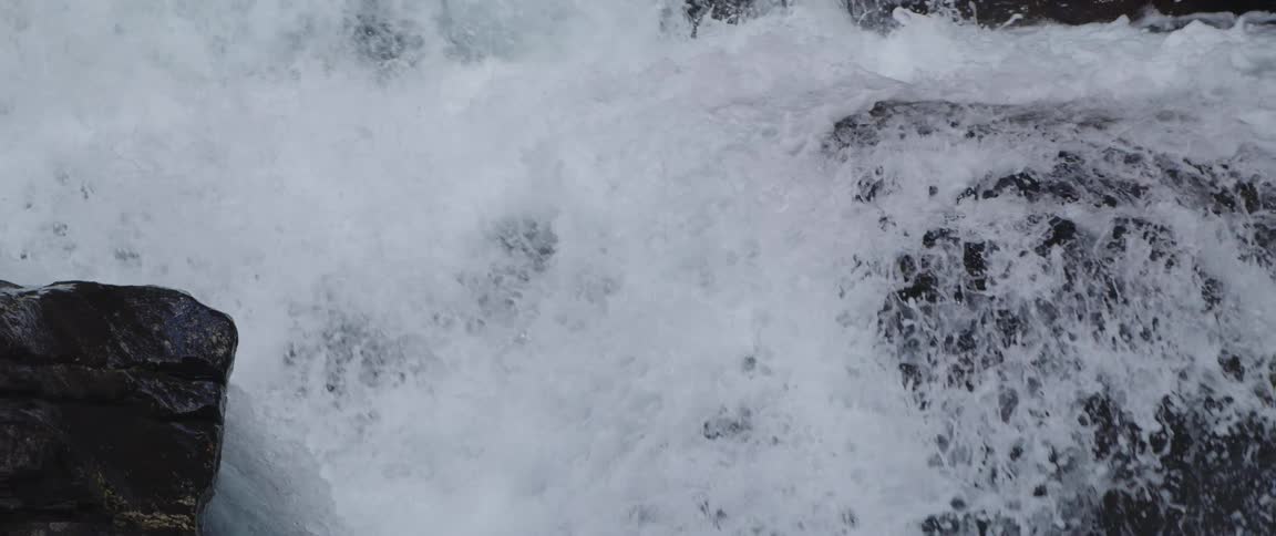 The rapids spray water as they splash down