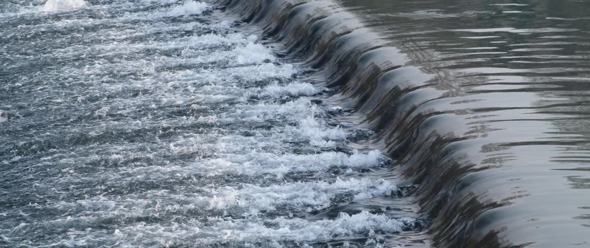 The water flows and moves over the step