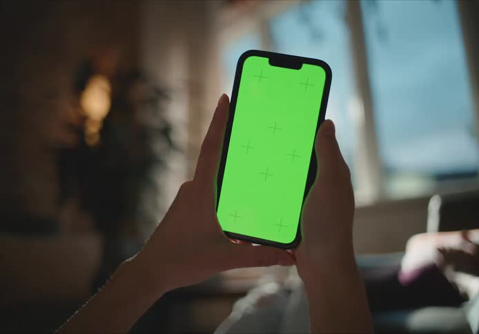 A person is looking at the screen on their phone
