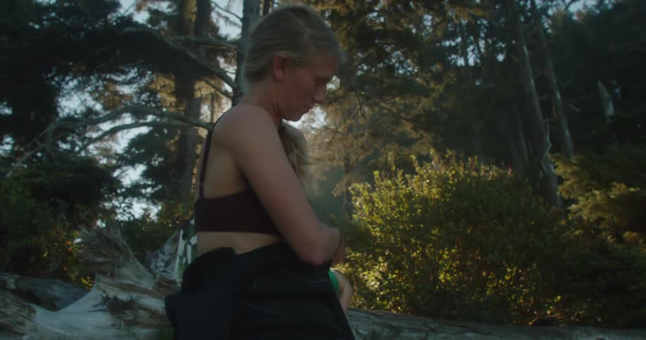 Group of women changing clothes for surfing in the forest at morning