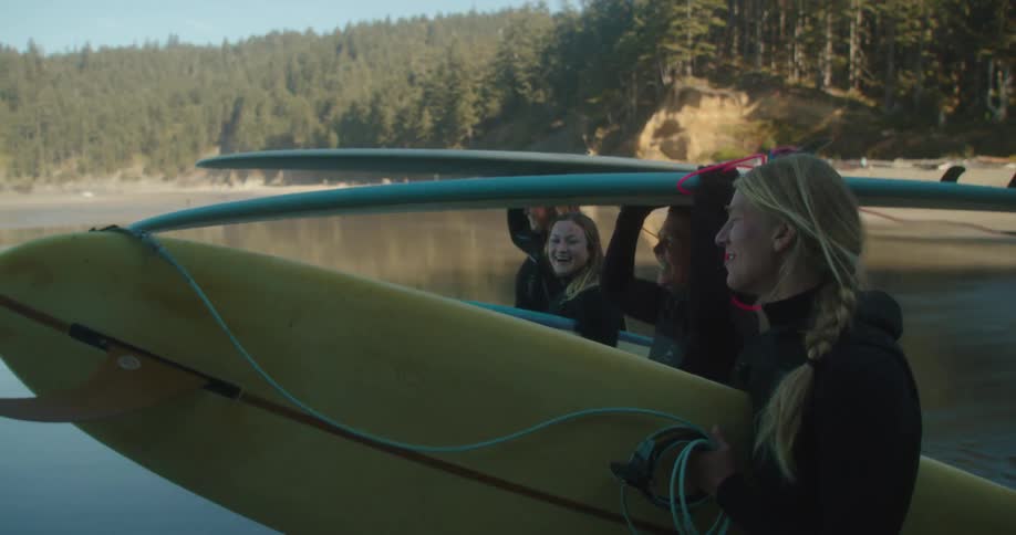 A group of friends are surfing together