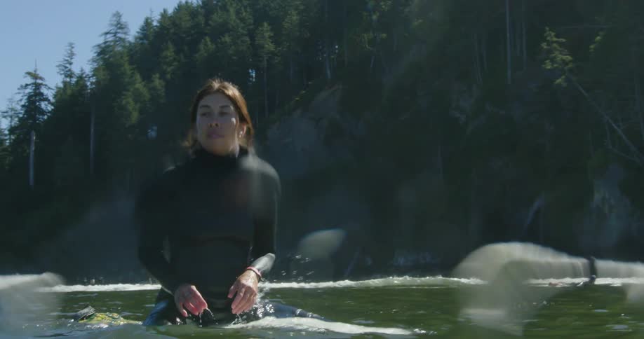 People are surfing by the shore