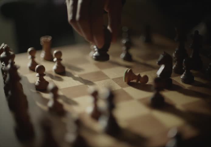 A person is playing a game of chess