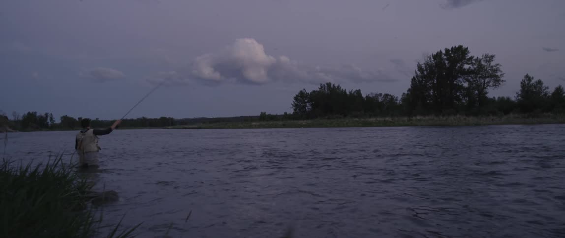 A man fishes in a river