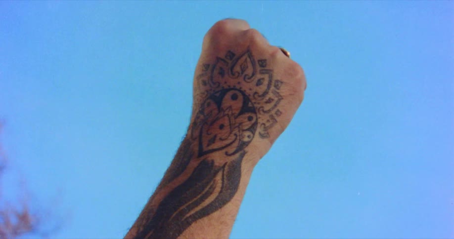 A man raises his clenched fist in to the air