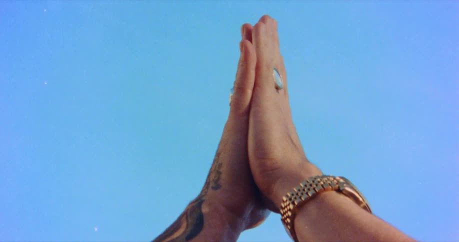 A person presses their hands together