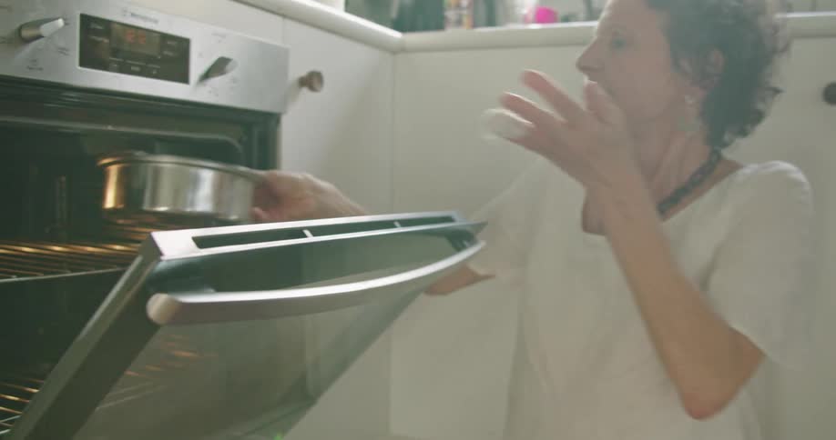 A mother and daughter baking in a kitchen