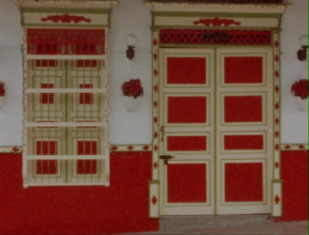 Red and cream white door and window mark entrance to business