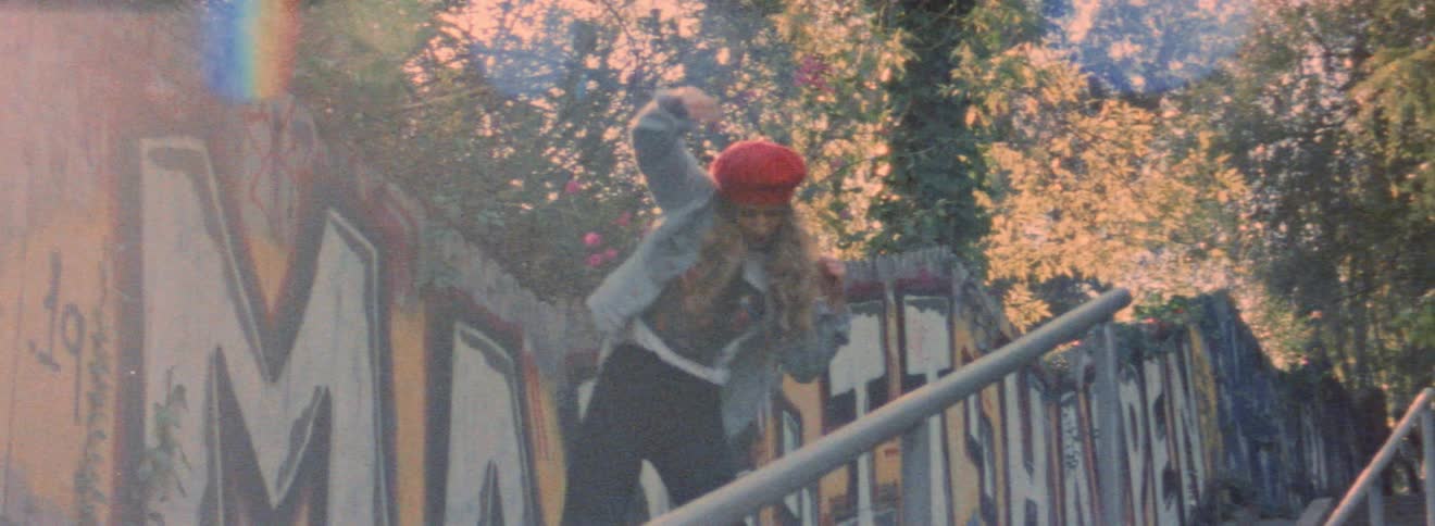 A woman is standing on a staircase dancing