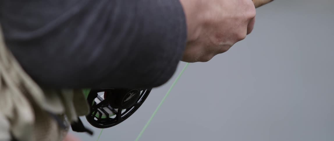 Man pulling on fishing line