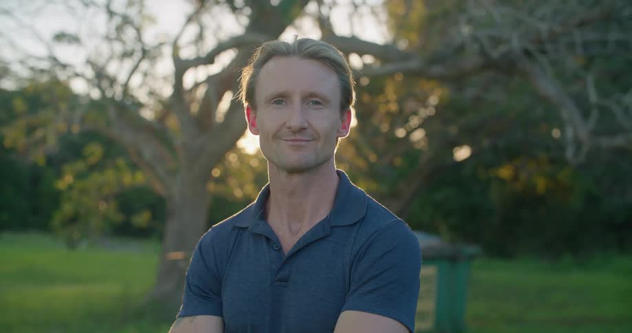 A portrait of a man standing outdoors