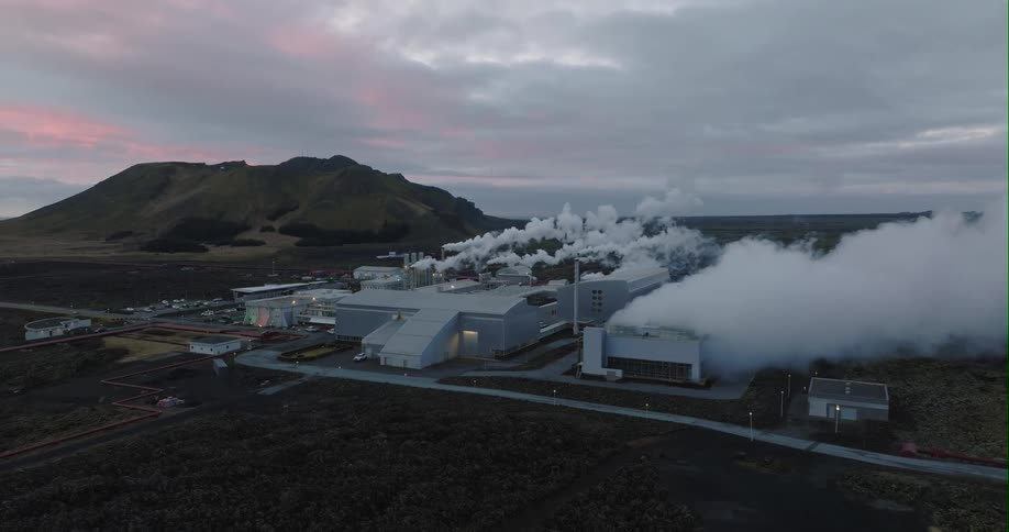 Smoke and steam billow from refinery and factory buildings