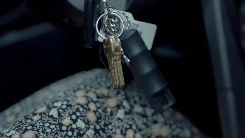 A view of keys hanging in a car