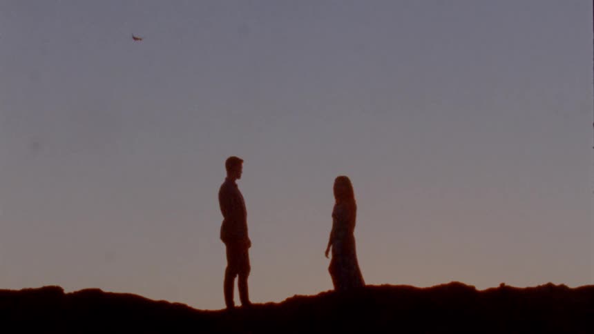 People standing on top of hill
