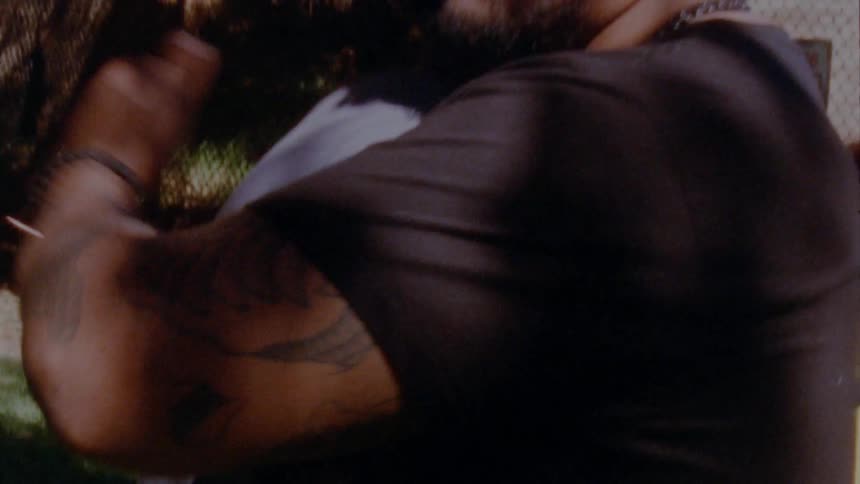 Friends handshake and hug each other in the backyard