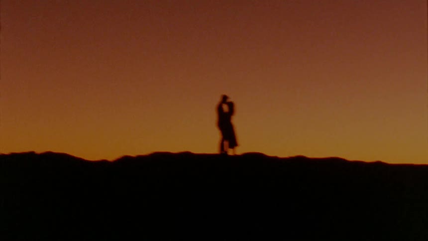 Man and woman standing on the horizon together