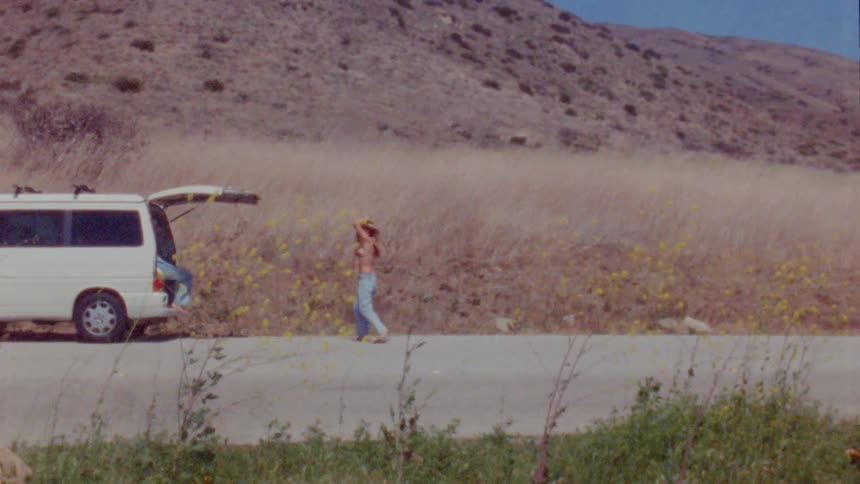 Person standing near a car