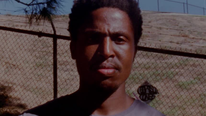 A portrait of a man standing outdoors