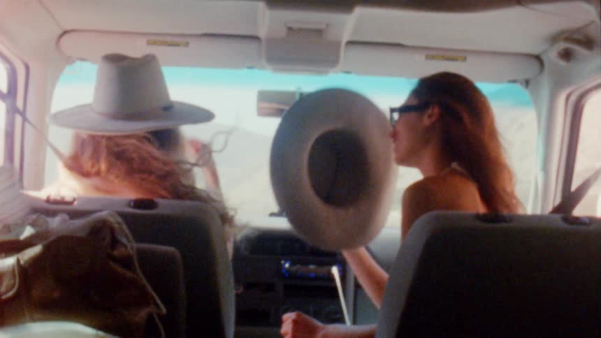 People wearing hats in a car