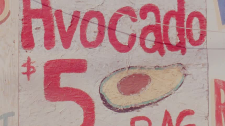 A large sign at a market