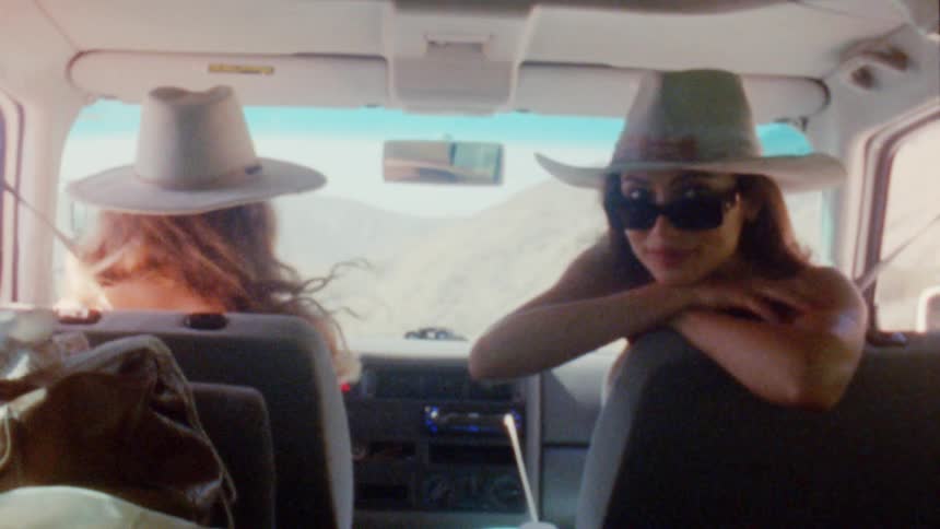 Two women driving a car