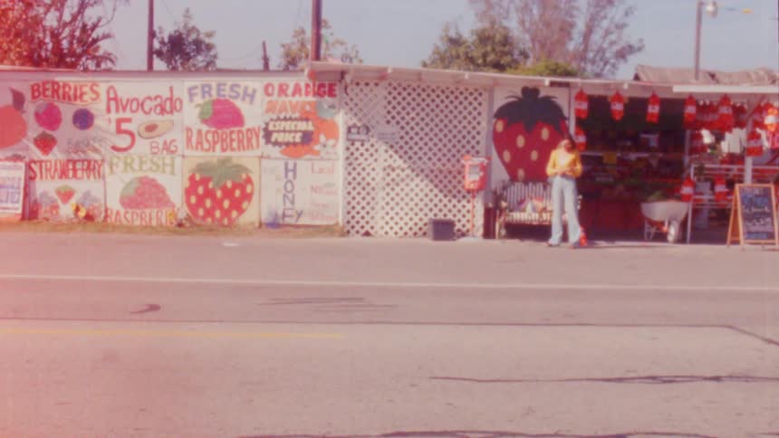 Person standing near food stand