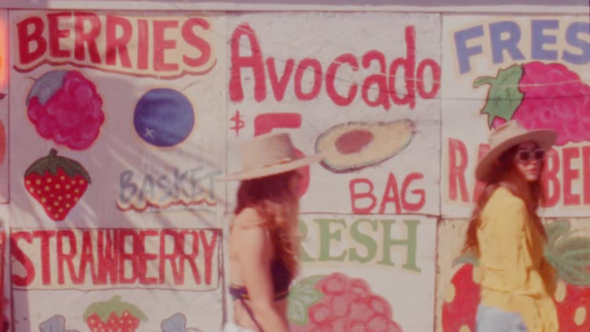 Females walking past sale signs