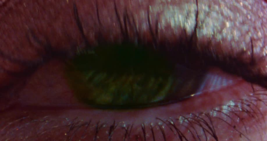 A blinking eye with eyeshadow and mascara