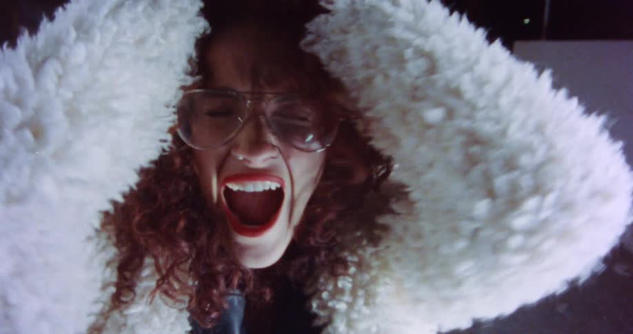 A portrait of a woman screaming