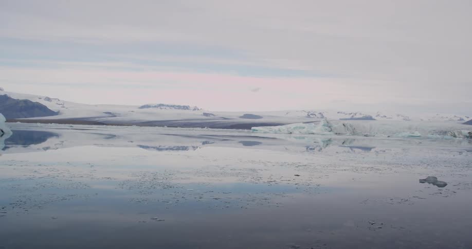 Ice and snow surround this body of water