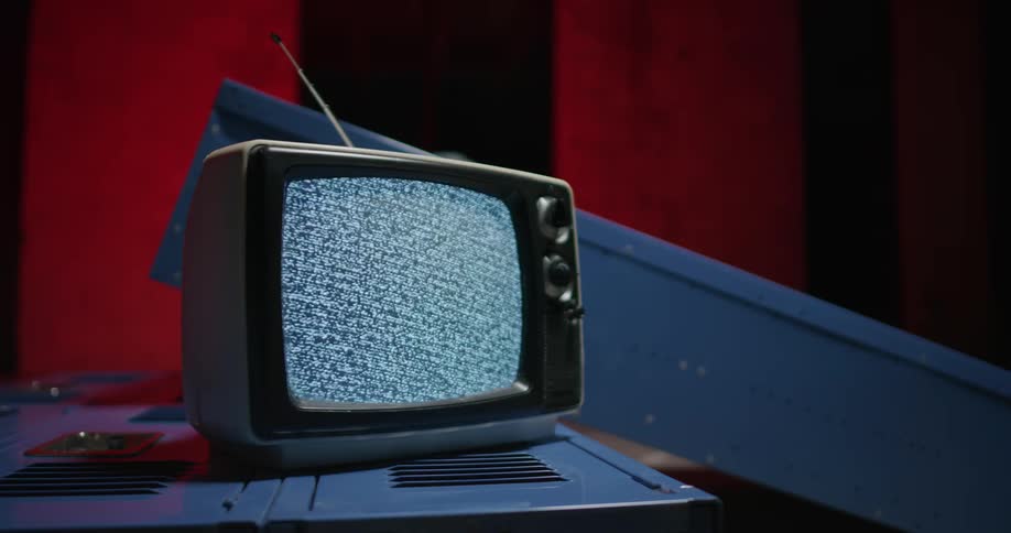 A small television is sitting on the fallen locker