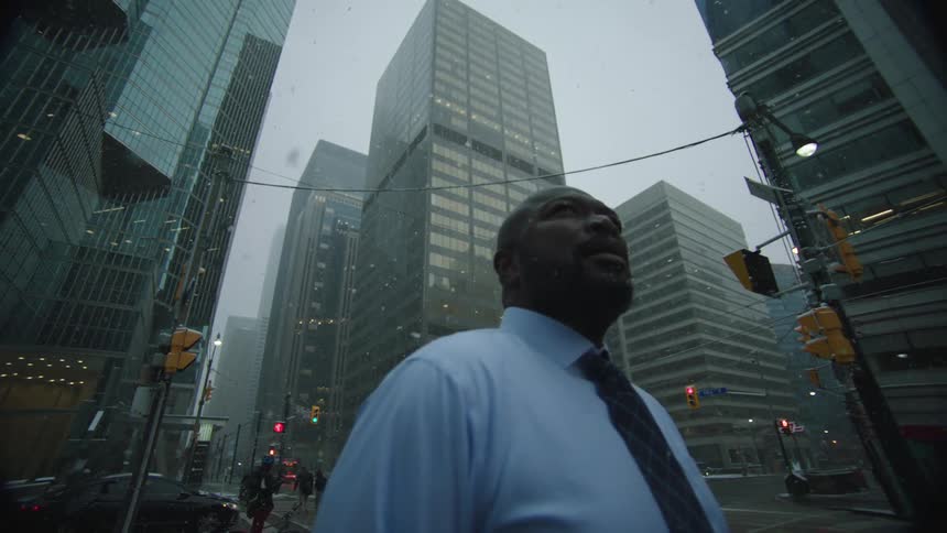 A man standing around outdoors in the snow