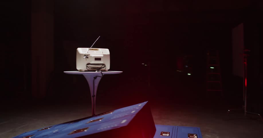 A tube television sits on a table surrounded by fallen lockers