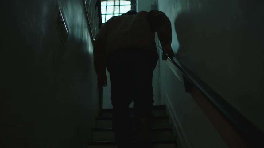 A man walking up stairs