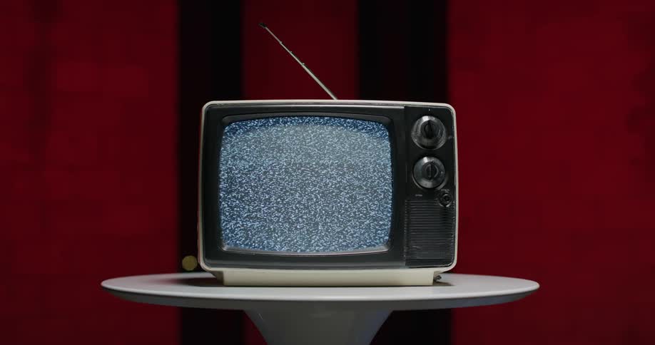 A television is sitting on top of a table in a room