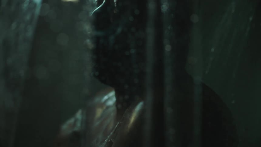 Close up of a black man taking a shower