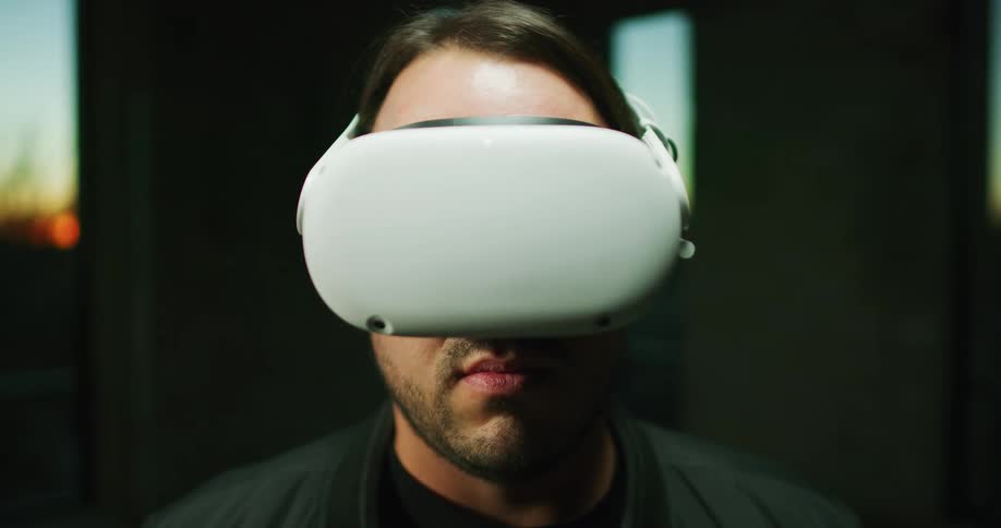 Man puts on virtual reality headset