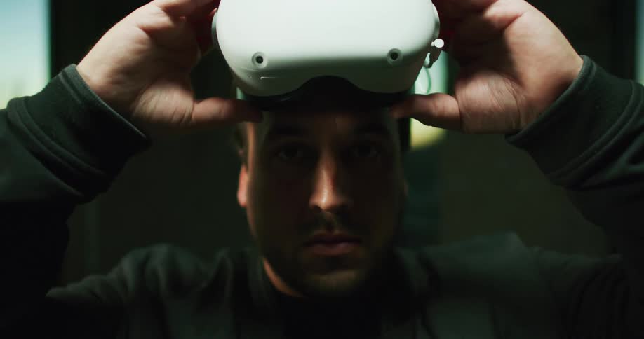 A man puts on a virtual reality headset