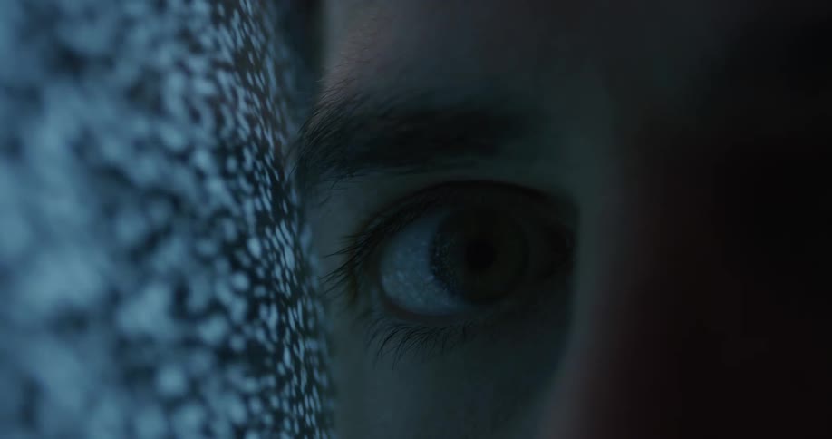 Static moves across a screen as a person has their eye next to the screen