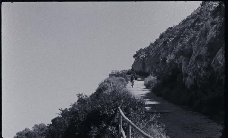 A person riding a bike down a mountain