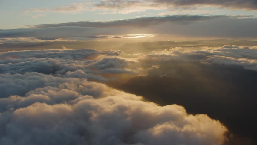 Stunning sunset with floating clouds captured above 10,000 feet