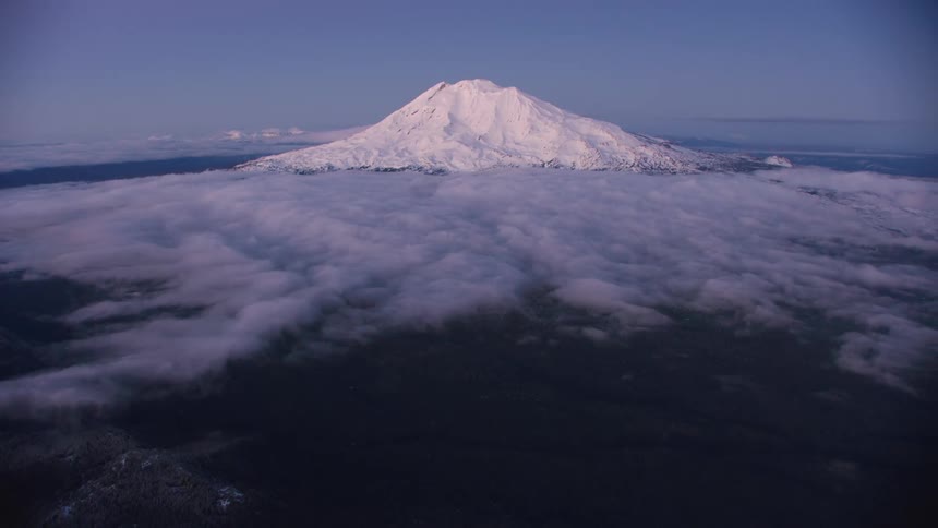 Blue hour aerial flying away from Mount Adams in the Pacific Northwest Cascade Mountains