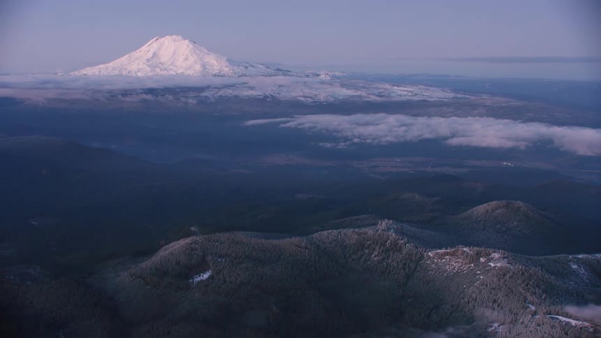 Flying high above snow covered ridges on Christmas Eve with Mount Adams in the background
