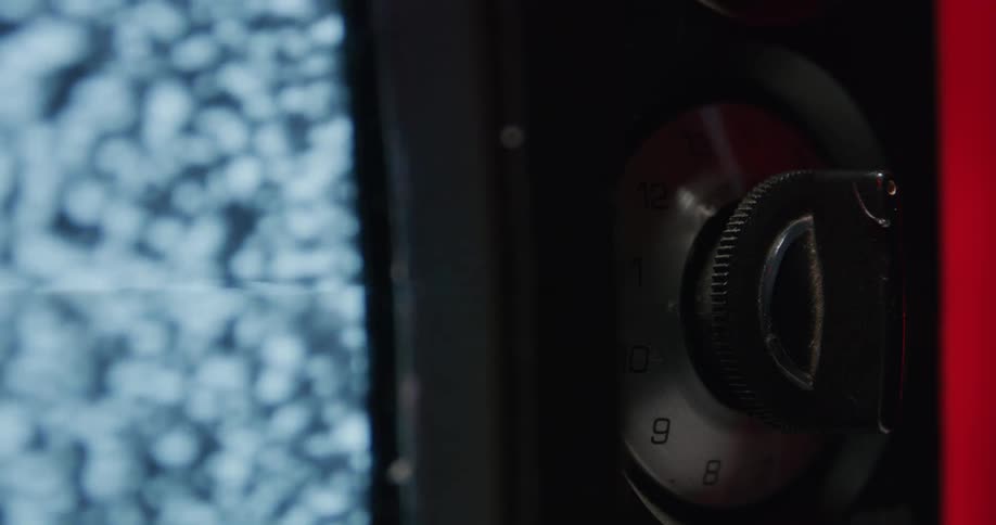 Close up view of a television screen and buttons